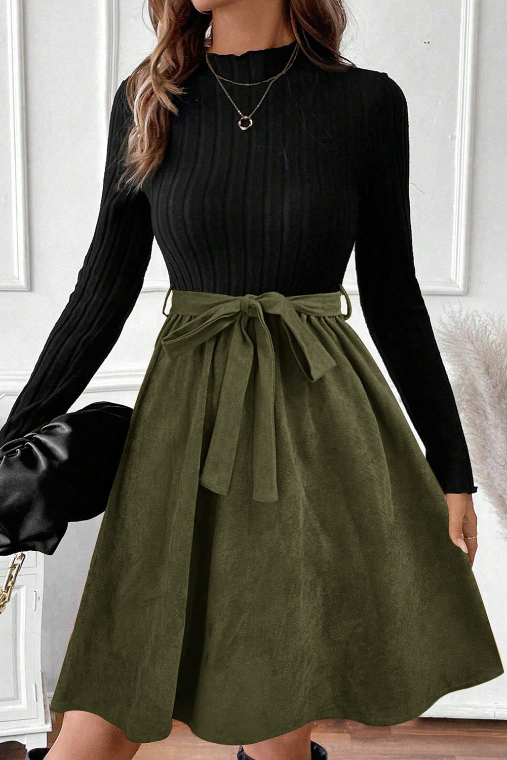 Chic Women's Black Ribbed Knit Dress with Slim Fit Bodice, Flared Skirt, and Trendy Belted Accent