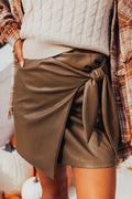 Chic Coffee Bowknot Faux Leather Mini Skirt for Women - Stylish and Trendy, Perfect for Day or Night Out