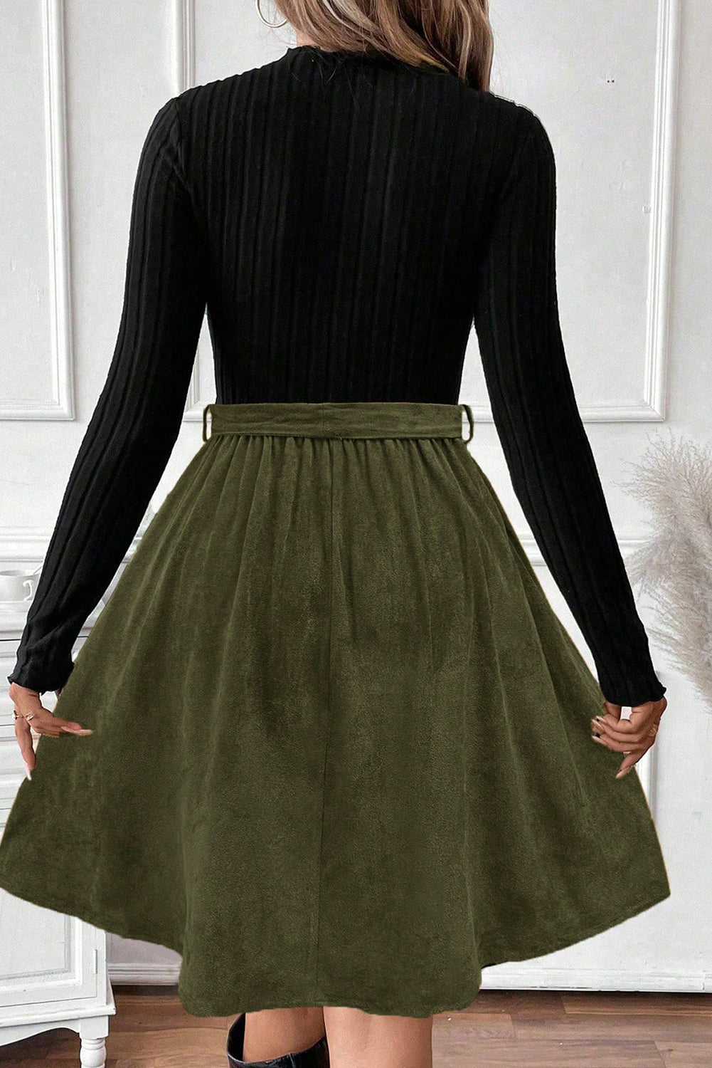 Chic Women's Black Ribbed Knit Dress with Slim Fit Bodice, Flared Skirt, and Trendy Belted Accent
