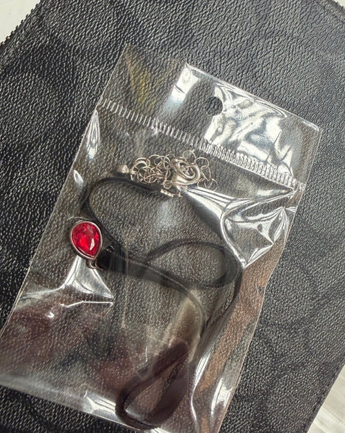 Charm choker necklace with red teardrop pendant