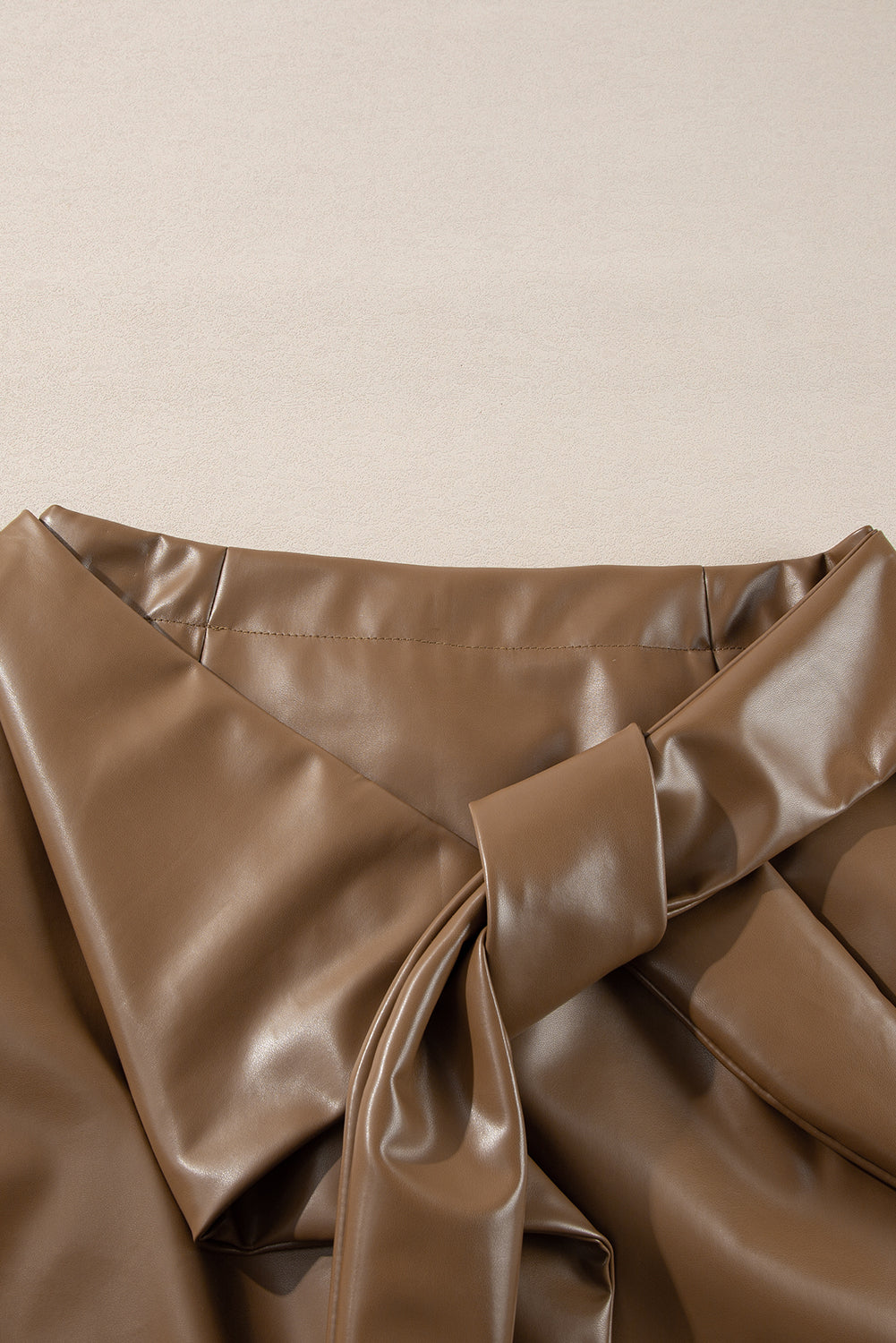 Chic Coffee Bowknot Faux Leather Mini Skirt for Women - Stylish and Trendy, Perfect for Day or Night Out