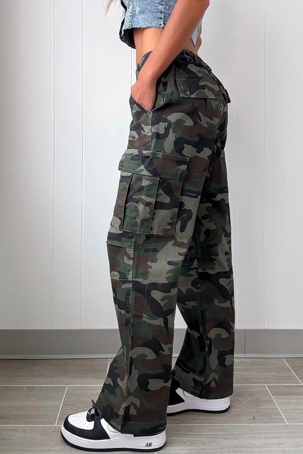 stylish women's green camouflage loose fit pants with button flap pockets and trendy patch accents made for easy styling and wardrobe coordination,