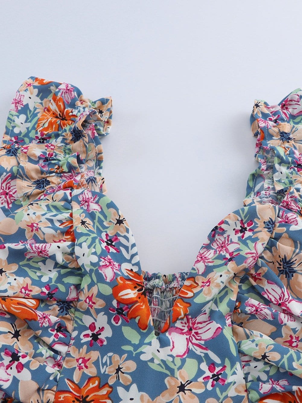 Chic Floral Sleeveless V Neck Cocktail Dress with Unique Hem